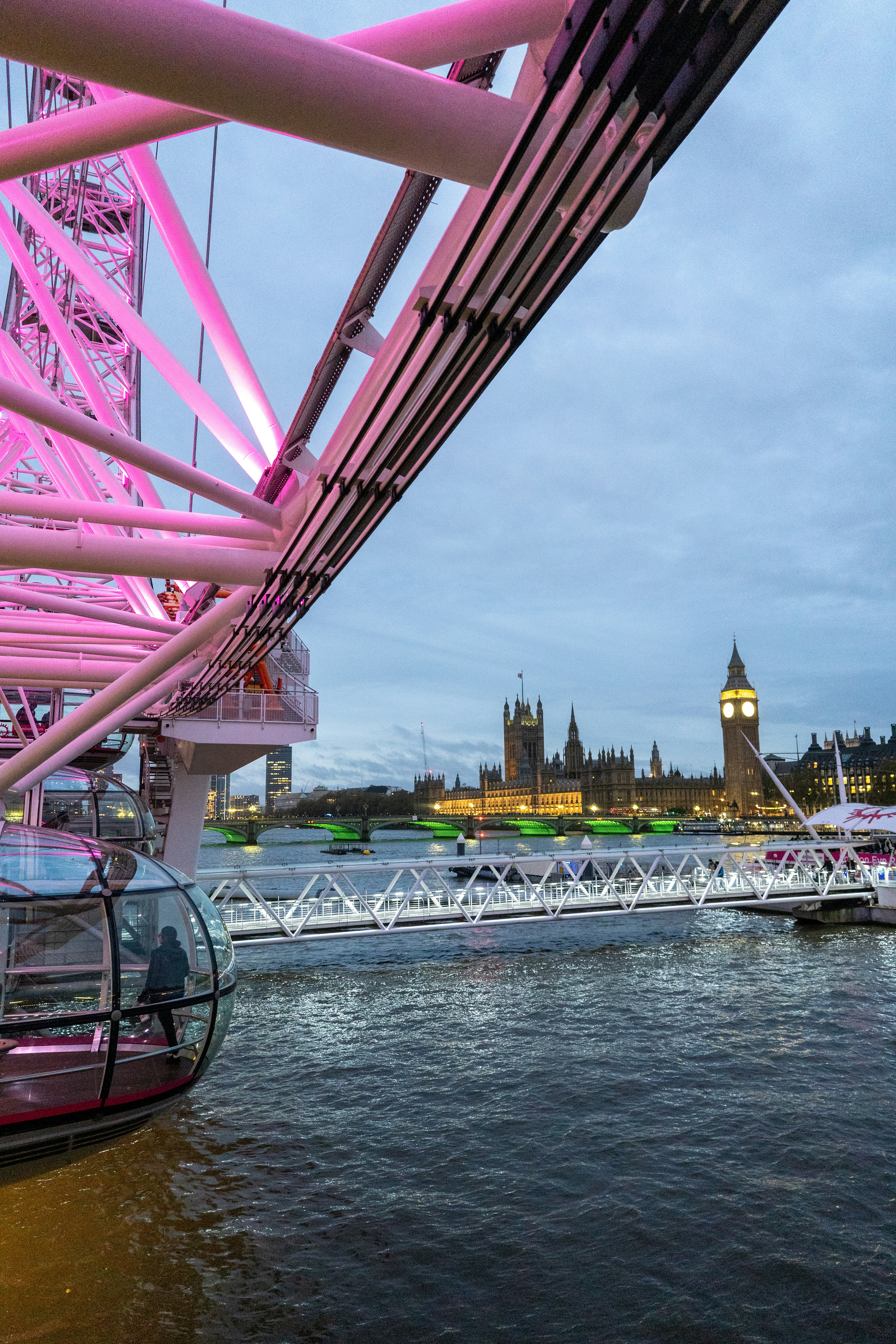 A view of a bridge with a clock tower in the background - Free Photo on ...