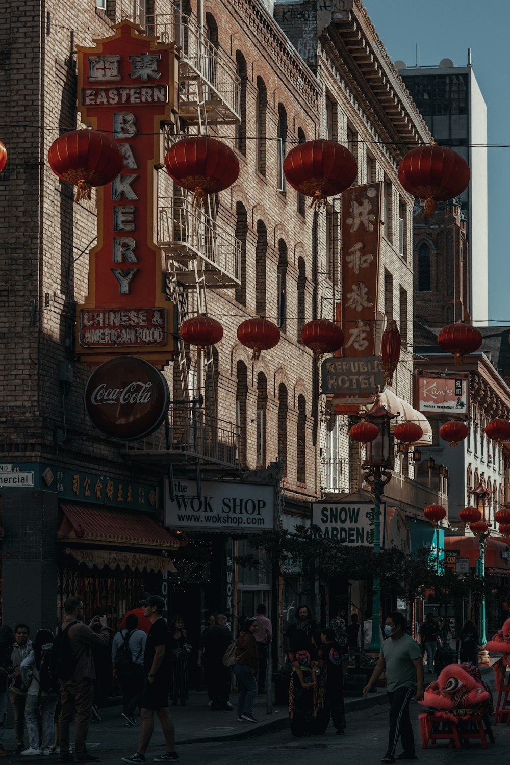 a city street filled with lots of red lanterns