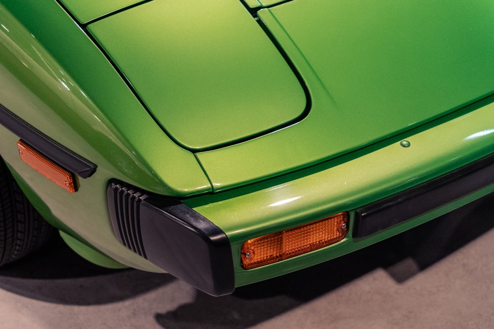 a close up of a green sports car