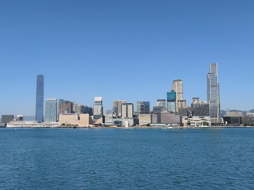 a large body of water with a city in the background