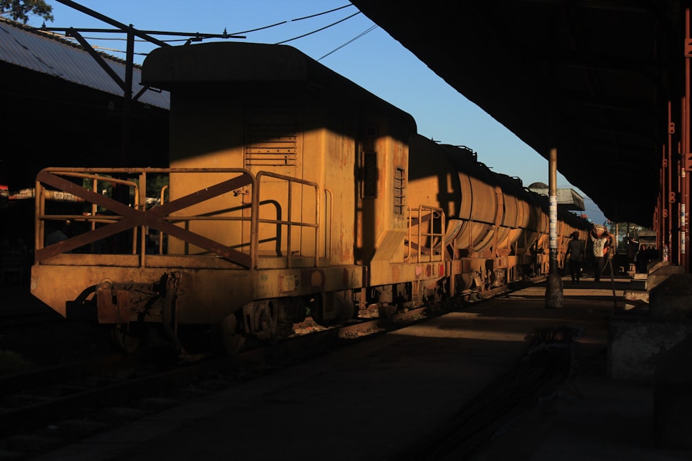 a train sitting on the tracks at a train station