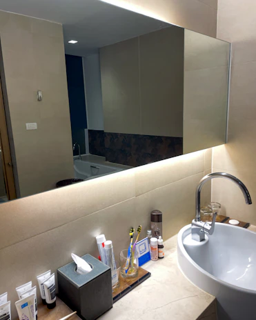 Bright bathroom countertop gleaming after using Aquaviva bath power clean liquid.