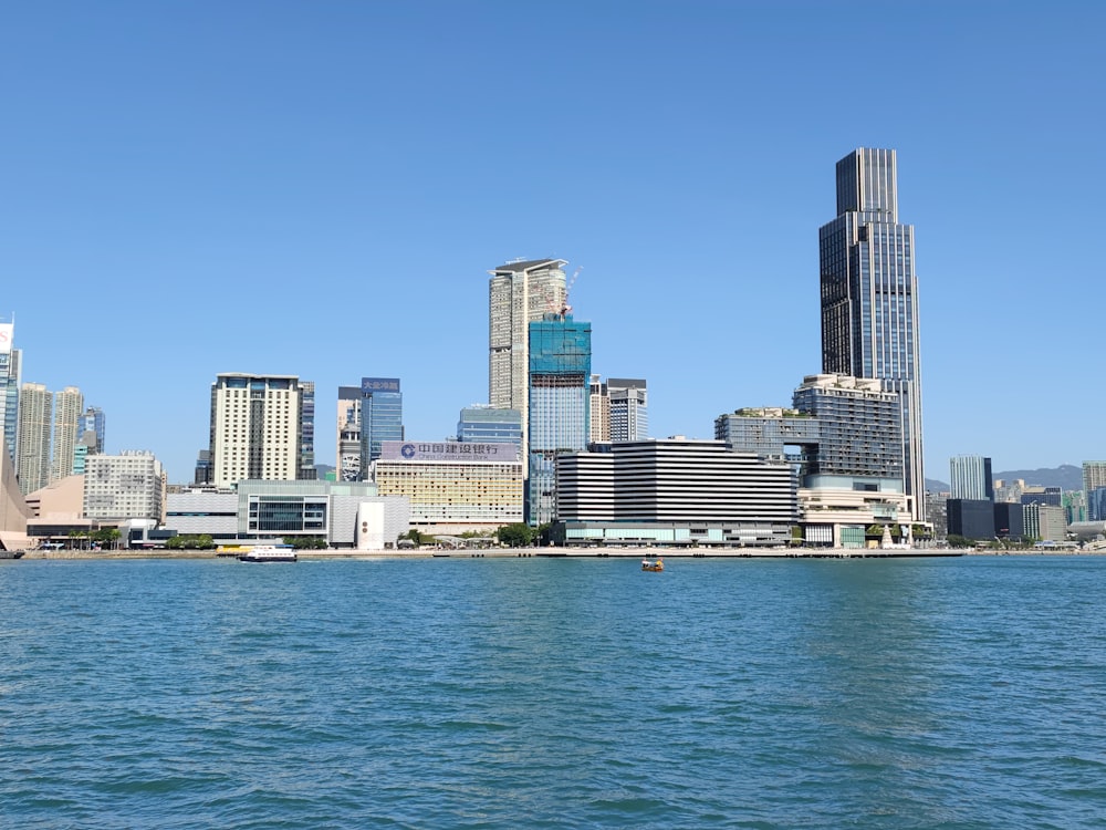 a large body of water with a city in the background