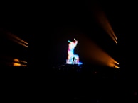A colorful light display synchronized with music on stage.