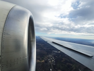 A scenic view of an airplane flying over a beautiful landscape.