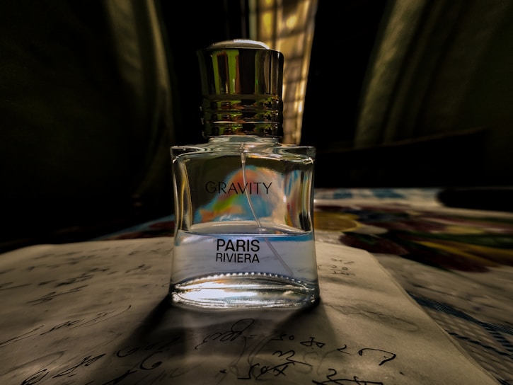 a bottle of perfume sitting on top of a table