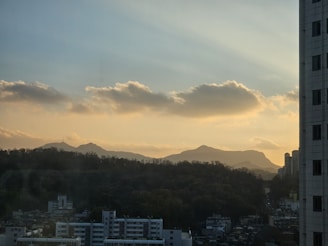 A serene residential plot with a clear view of the Yamuna Expressway at sunset.