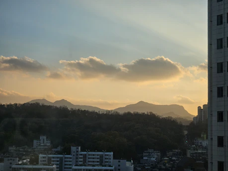A serene sunset view over a modern residential complex by Sai Skyline Infra in Udaipur.