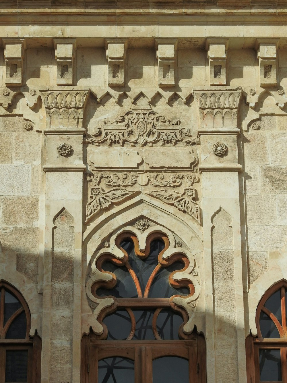 a building with a large window and a clock on the front of it