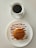 A cozy breakfast table set with a steaming cup of coffee and a delicious plate of pancakes.
