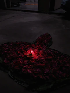 A sensual scene featuring a discreet, elegant bullet vibrator beside rose petals.