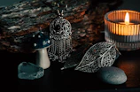 An arrangement of glowing magical accessories nestled among dried flowers and crystals.
