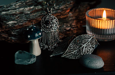 An arrangement of glowing magical accessories nestled among dried flowers and crystals.
