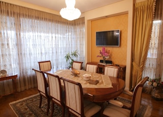 a dining room with a table and chairs