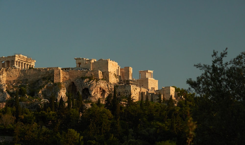 a very tall building on top of a hill