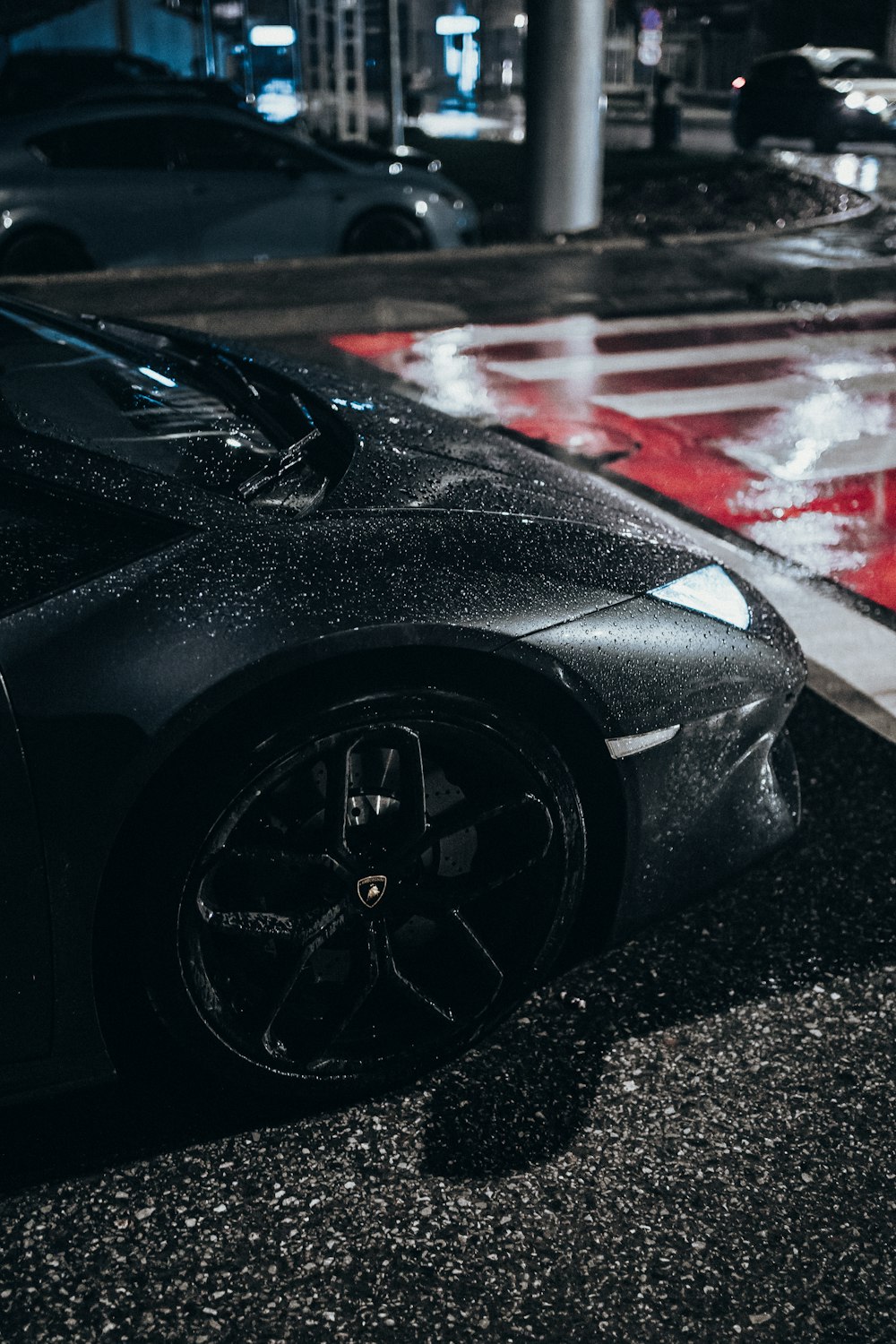 a black sports car parked on the side of the road