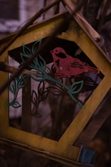 Creative wooden birdhouse assembled with unique design.