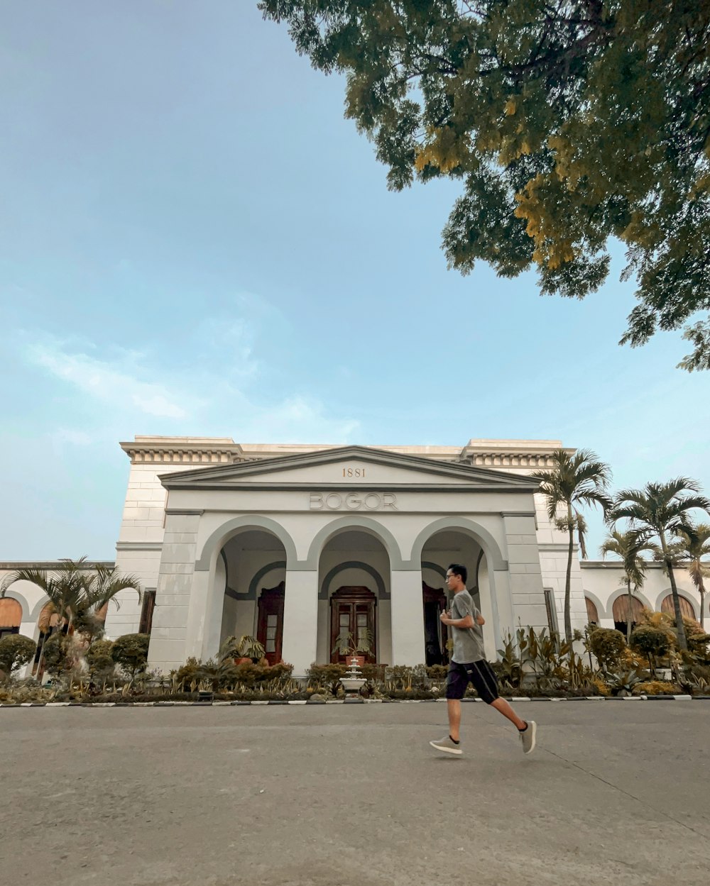 a man running in front of a building