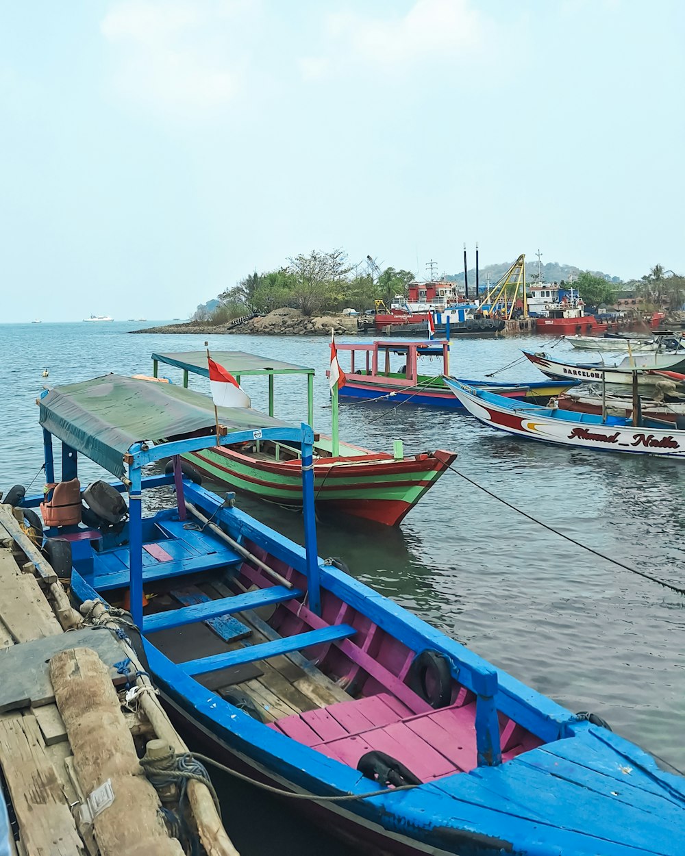 a number of small boats in a body of water