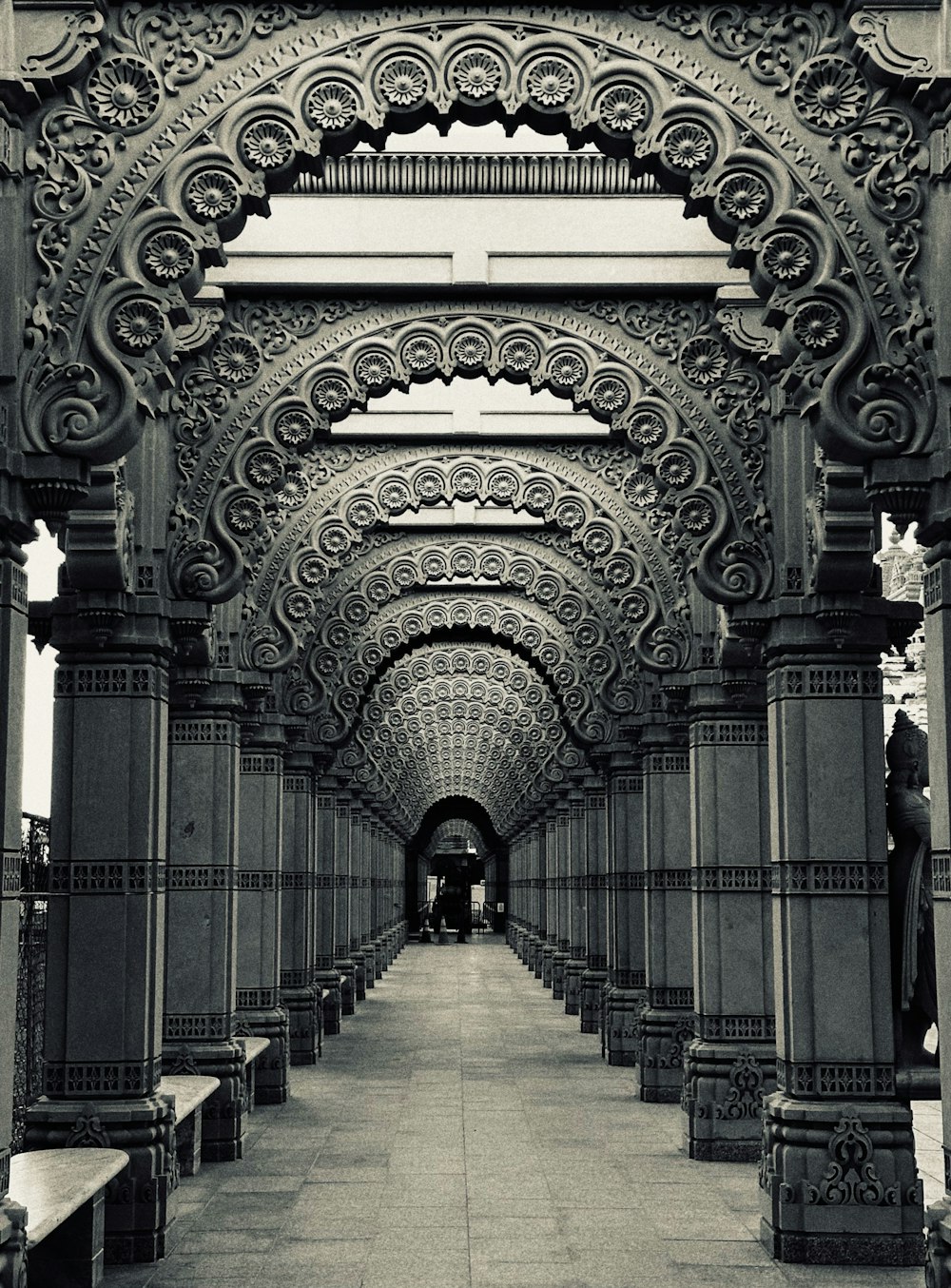 a black and white photo of a walkway