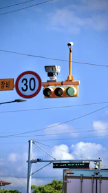 Technicians installing speed limiting devices and CCTV cameras on commercial transport vehicles.