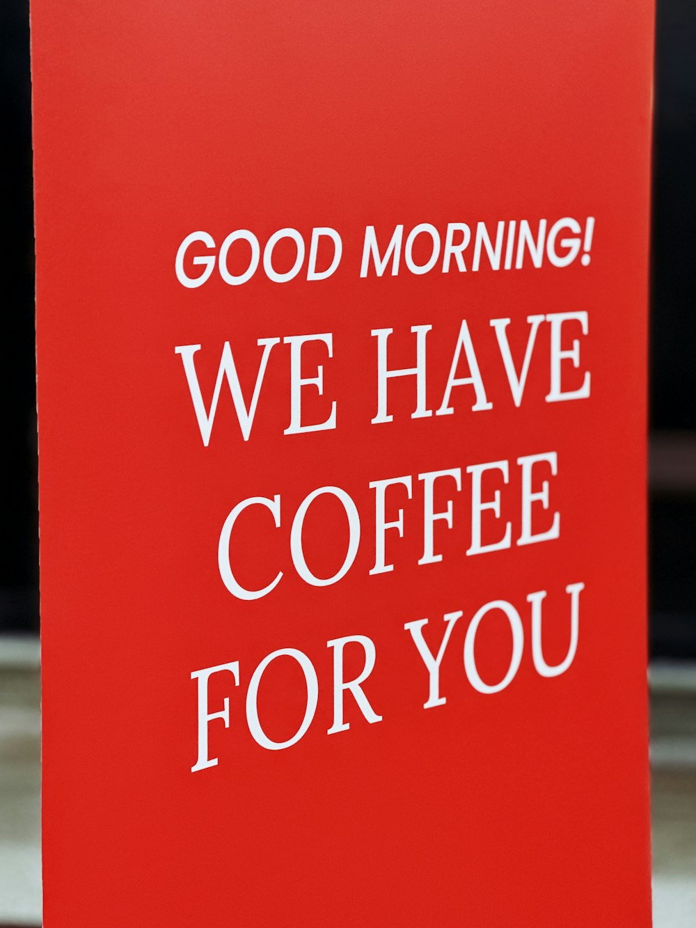 a red sign that says good morning we have coffee for you