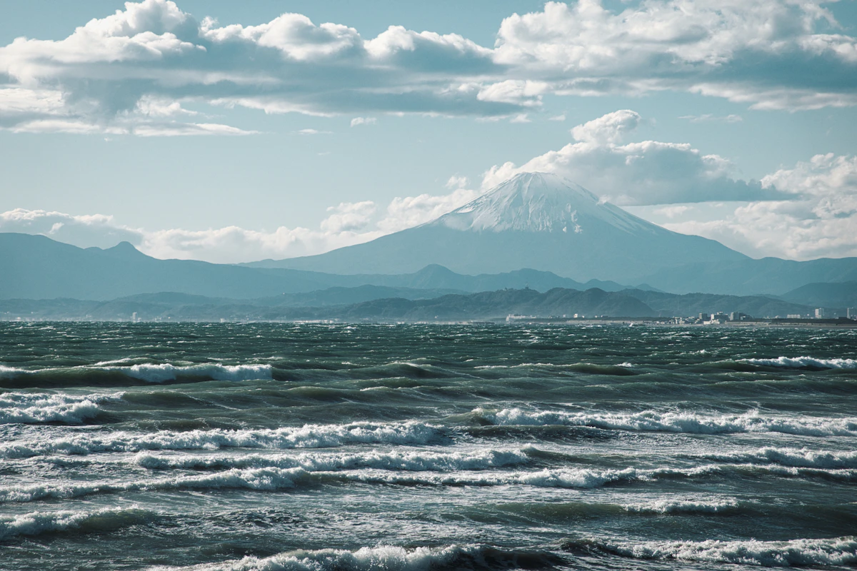 Dramatic ocean vista along Japan's coast with mountains in the background