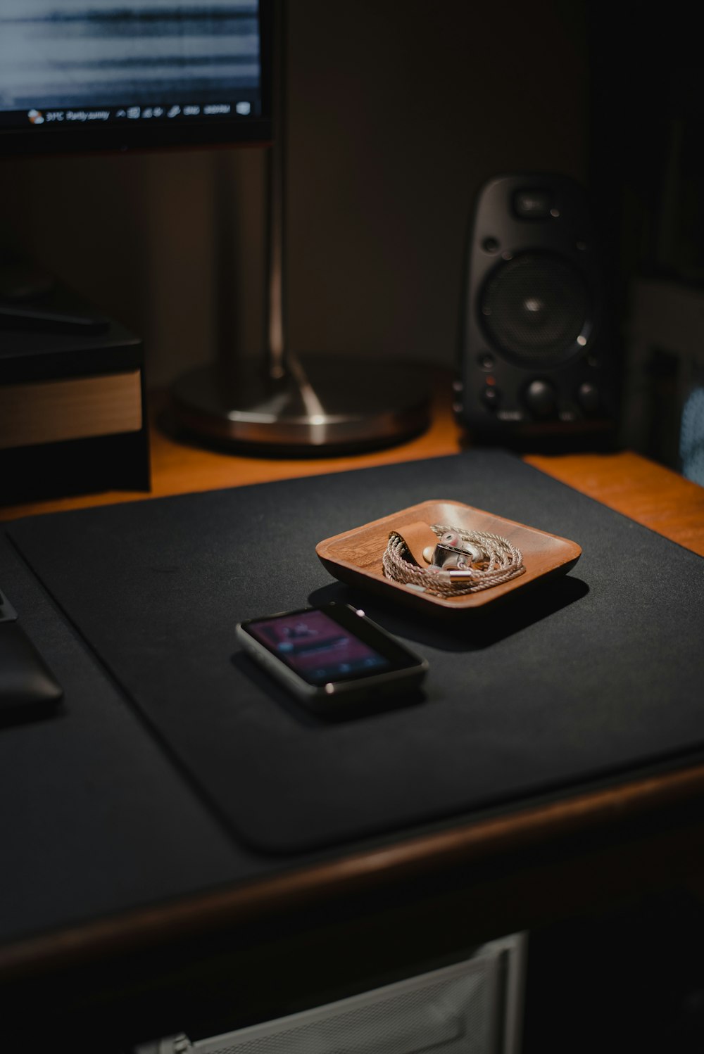 a cell phone sitting on top of a wooden table