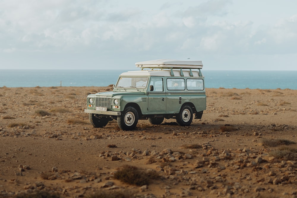 a van parked in the middle of the desert