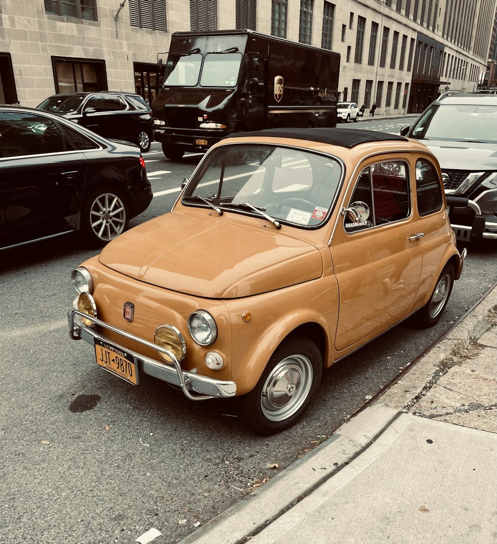 an old car is parked on the side of the road