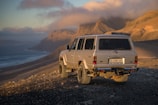A classic SUV parked in a scenic location.