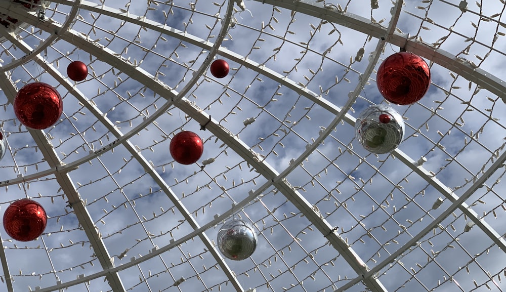 a metal structure with ornaments hanging from it