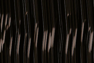 A UV printed creation featuring minimalist gold patterns on a dark background.