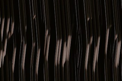 Abstract dark navy background with subtle metallic gold lines forming a secure network pattern.