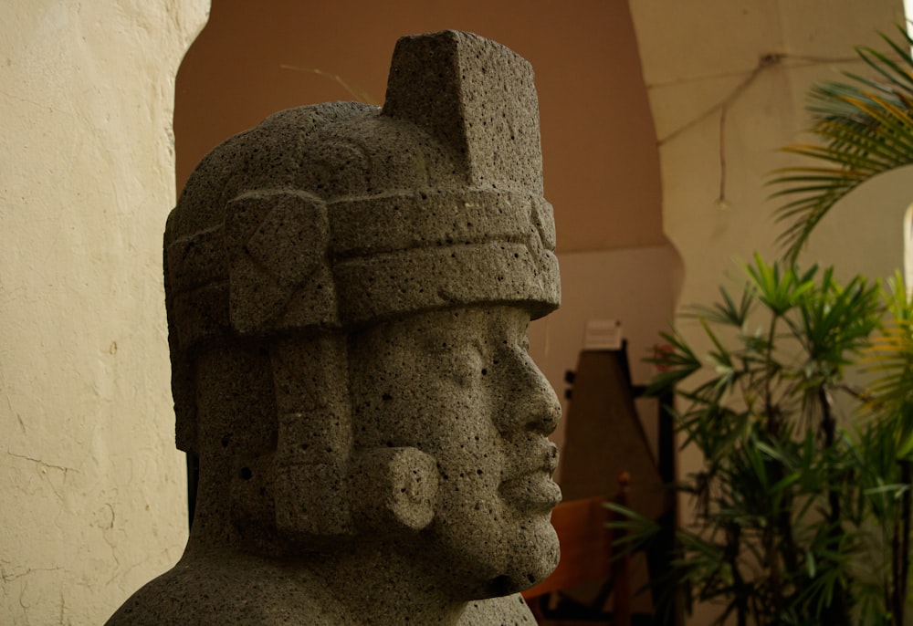 a statue of a man wearing a headdress