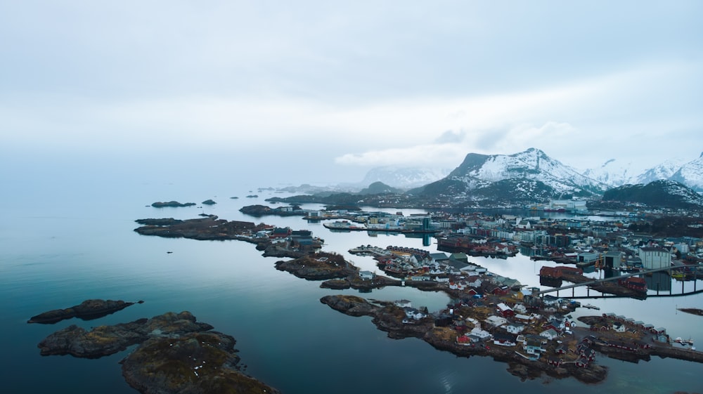 an aerial view of a small town on a body of water