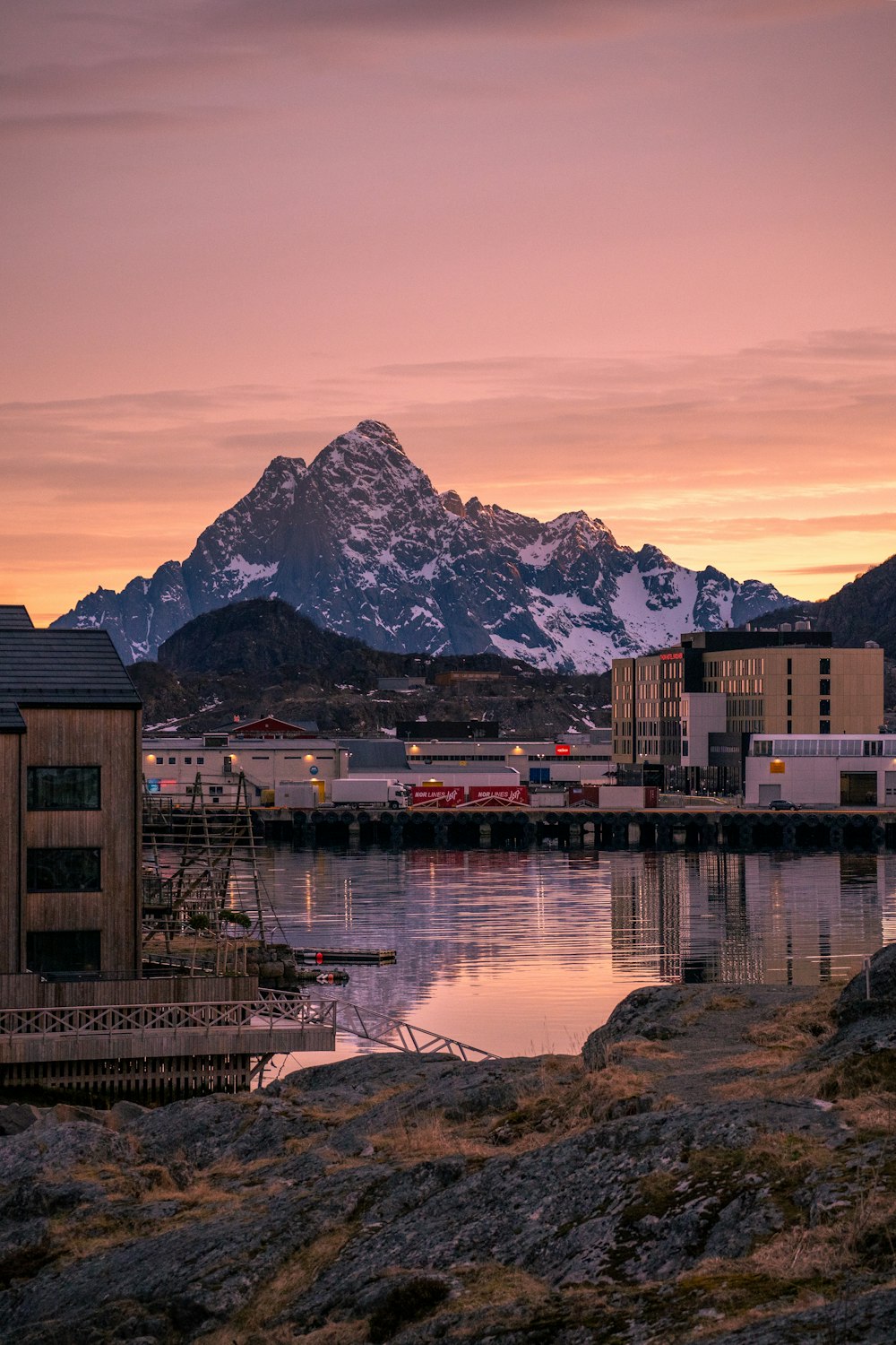 a body of water with a mountain in the background