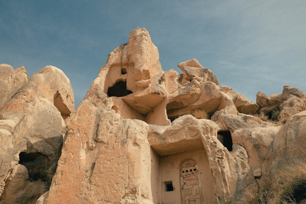 a rock formation with a door in it