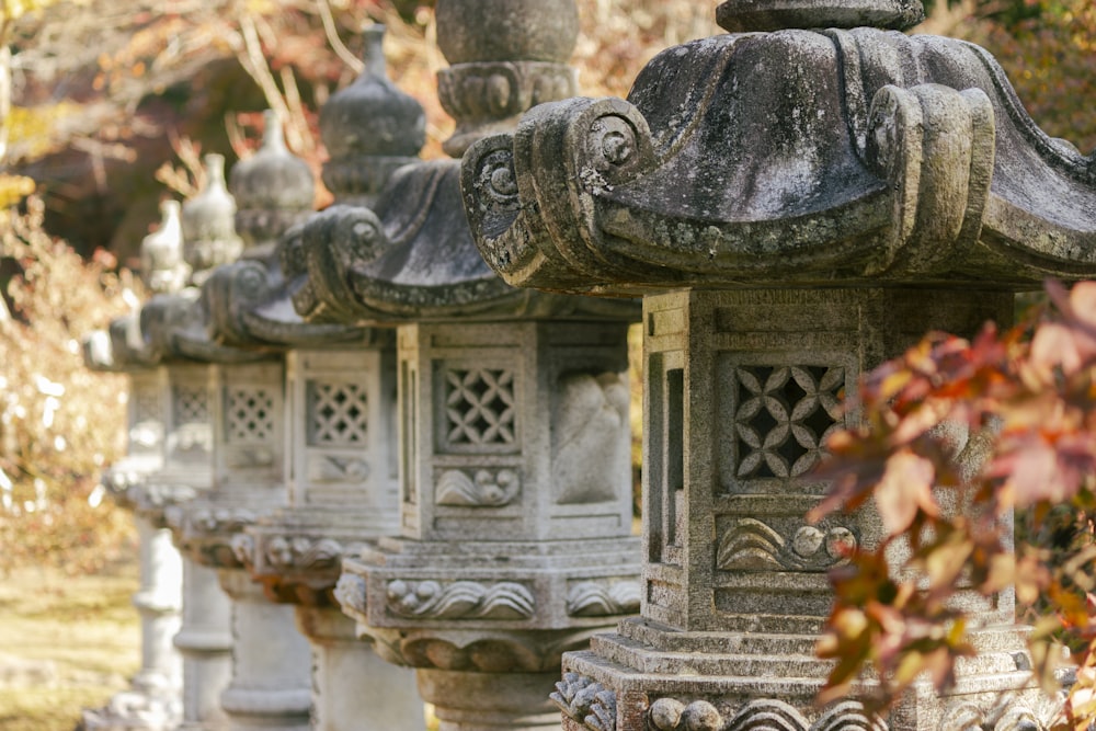 a row of stone lanterns sitting next to each other