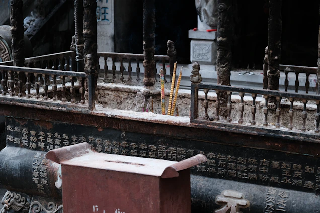 A close-up photo of intricately crafted traditional Chinese incense bracelets displayed on a wooden table with soft natural light.