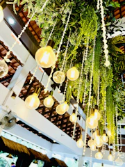 Decorative lighting installation highlighting green lime lights on black walls.
