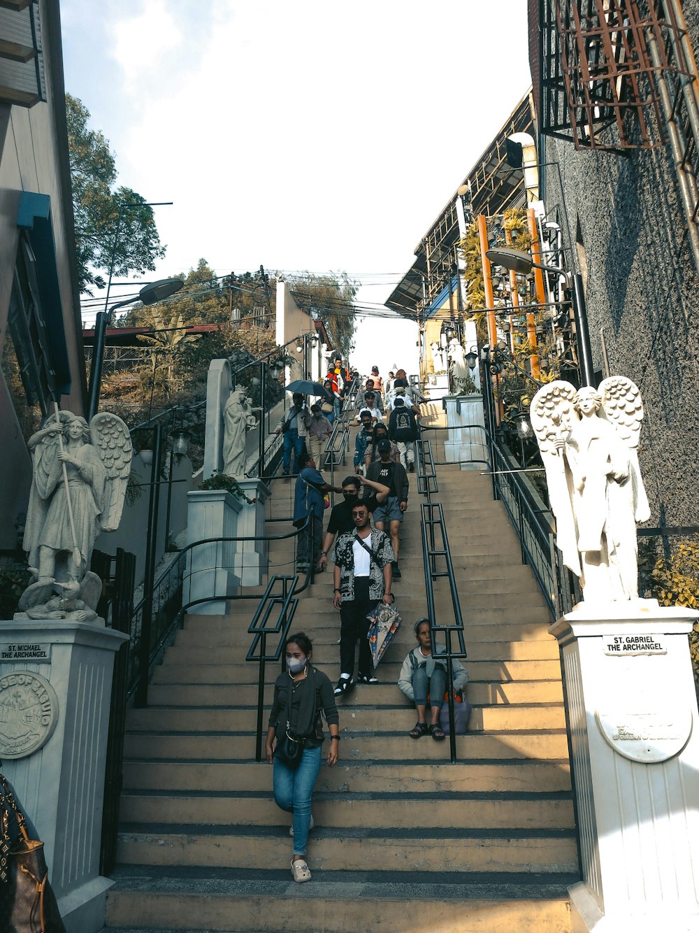 a group of people walking up a flight of stairs