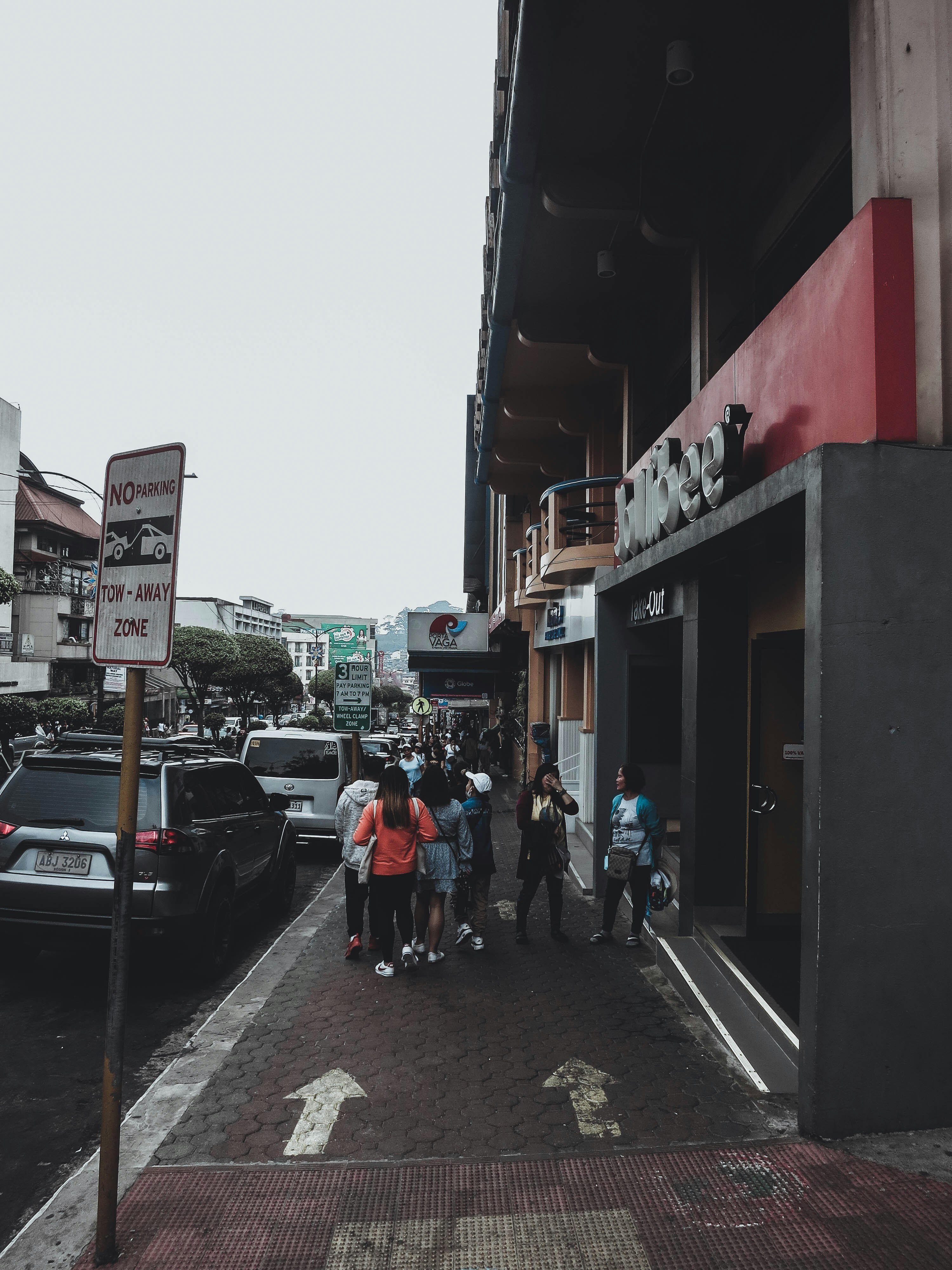 a group of people standing outside of a building