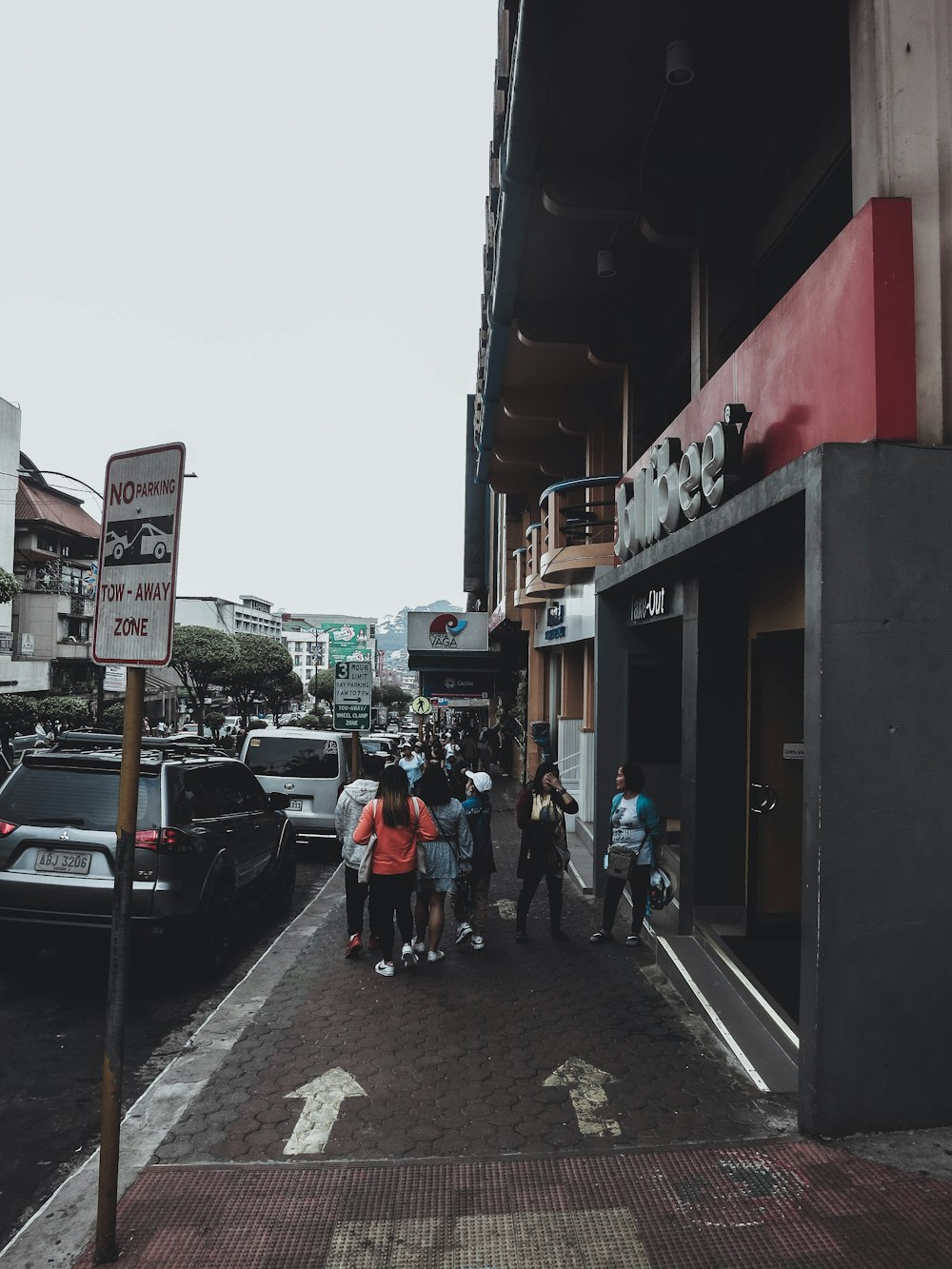 a group of people standing outside of a building