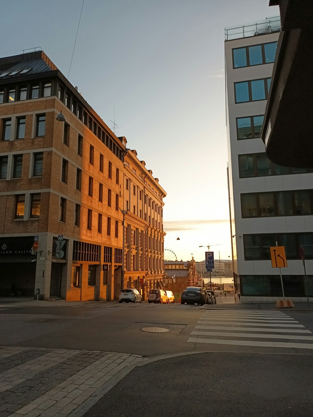 a city street with cars parked on the side of it