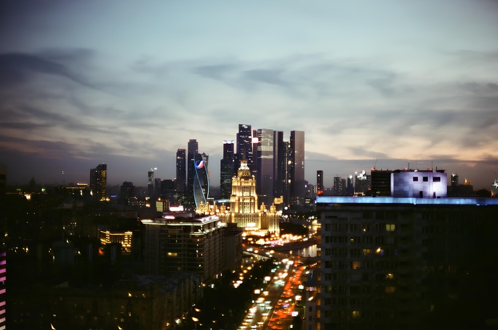 a view of a city at night from the top of a building