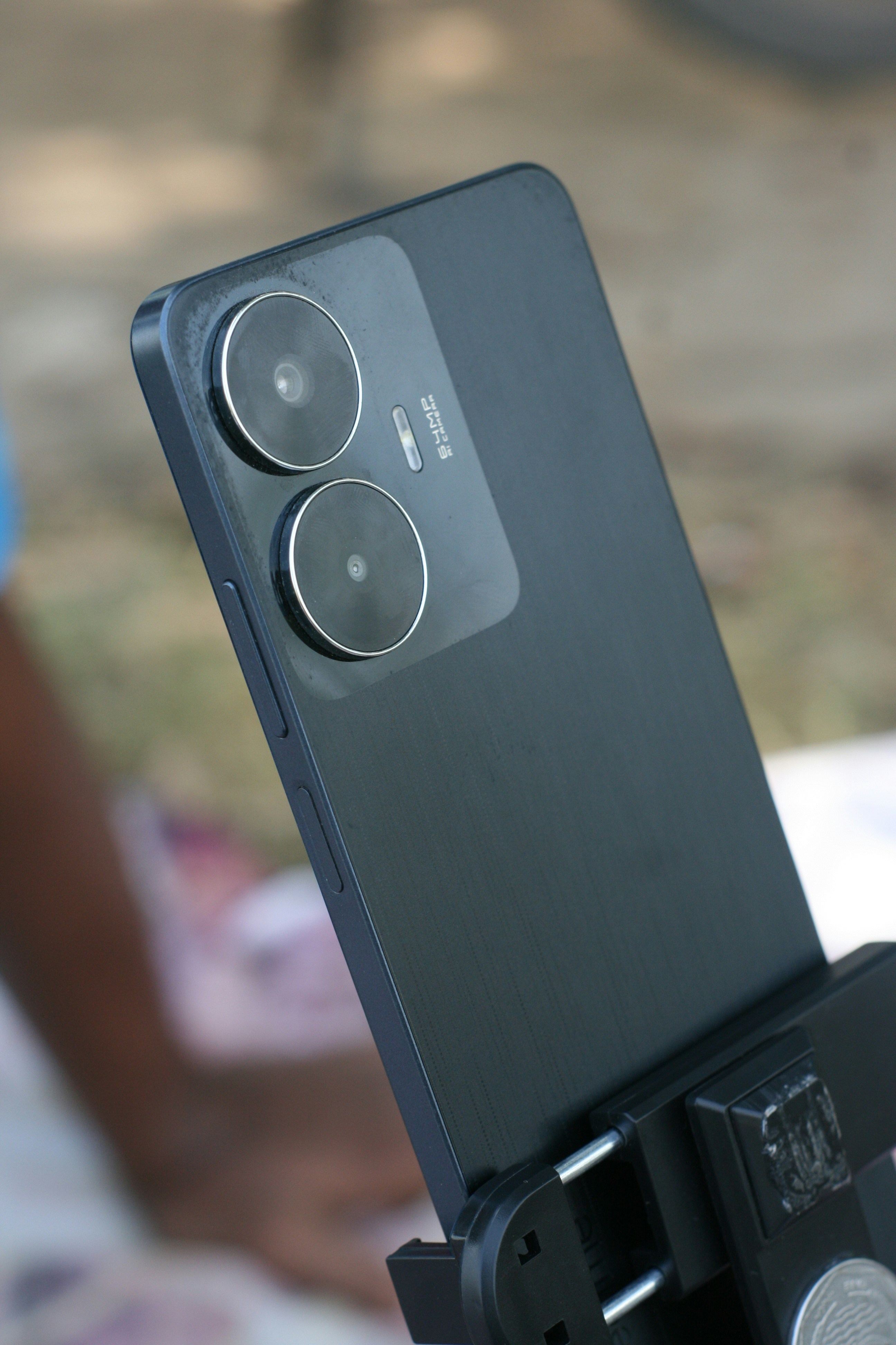 a close up of a cell phone on a tripod