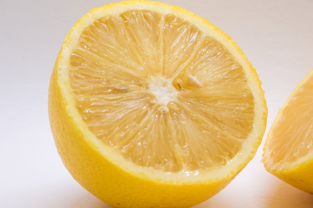 a close up of a sliced lemon on a table