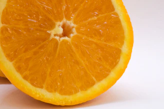 Close-up of a mango cut open, revealing juicy, bright orange flesh.