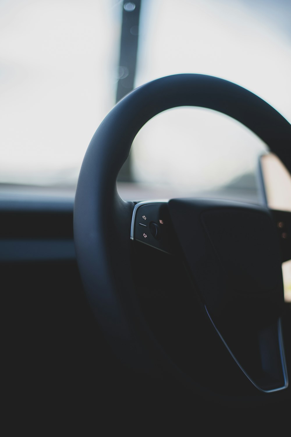 a close up of a steering wheel of a car